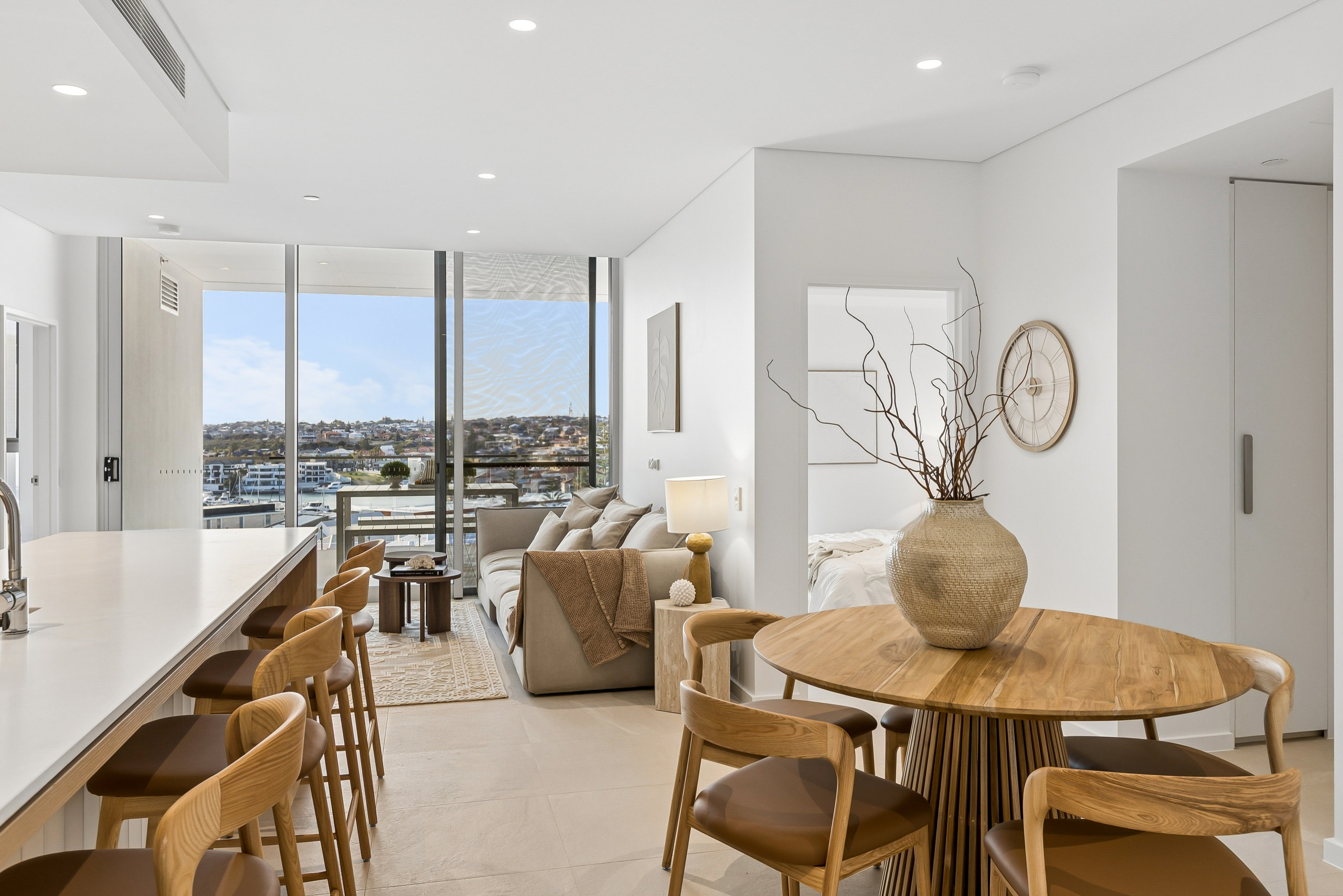 Open living and dining opening to a marina view